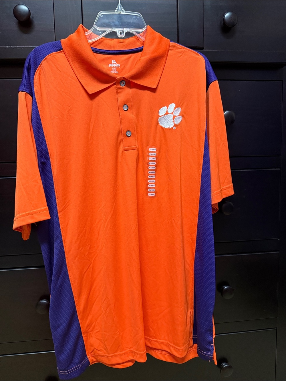 Knights Apparel Orange Polo with Purple Trim and White Paw